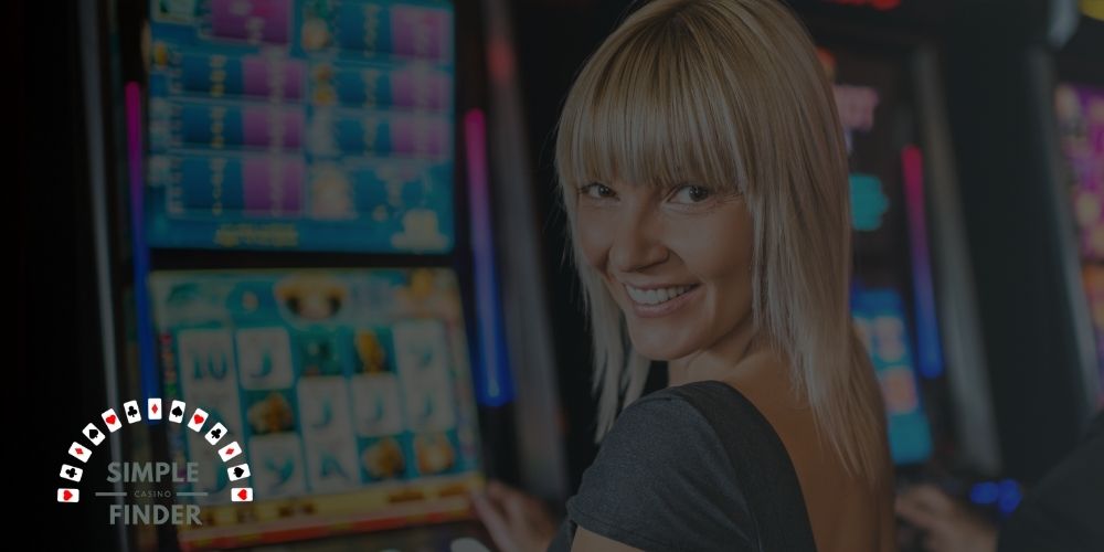 featured image for best video slot casino where a blond lady looks over her shoulder whily playing a video slot